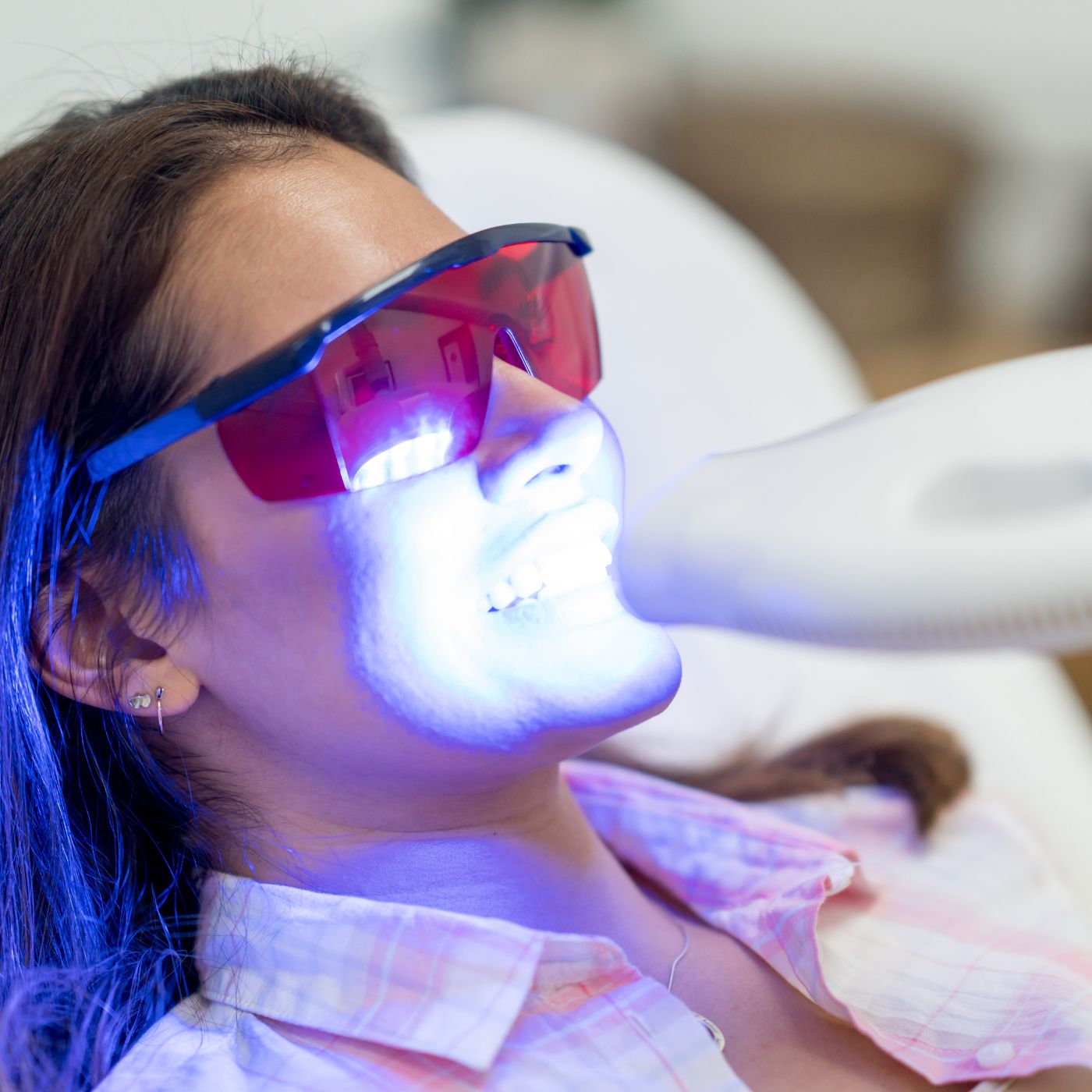 Laser teeth whitening session in progress